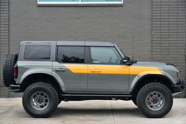 2022 Ford Bronco Wildtrak V6 4-Door, gray with orange accents, previously sold by Sandbox Motors