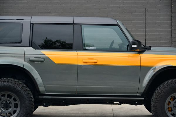 2022 Ford Bronco Wildtrak V6 4-Door, gray with orange accents, previously sold by Sandbox Motors