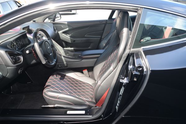 Black and red 2015 Aston Martin Vanquish Q Collection for sale by Sandbox Motors.