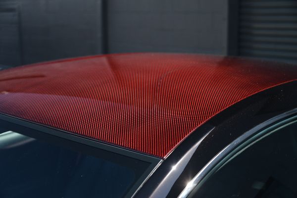 Black and red 2015 Aston Martin Vanquish Q Collection for sale by Sandbox Motors.