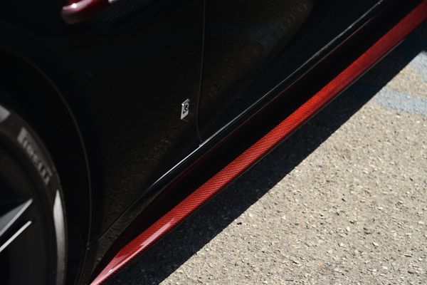 Black and red 2015 Aston Martin Vanquish Q Collection for sale by Sandbox Motors.